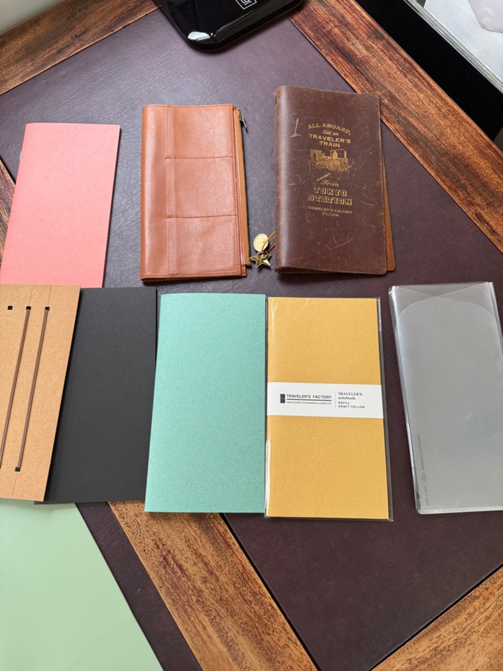 Traveler's Notebook with Wallet and extra inserts.